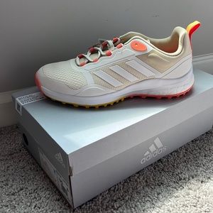 ZOYSIA Spikeless gold shoe by Adidas